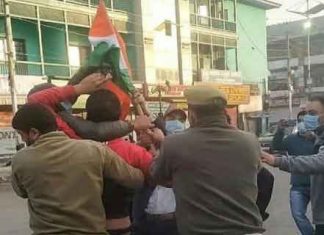 BJP Worker Hoisting Flag